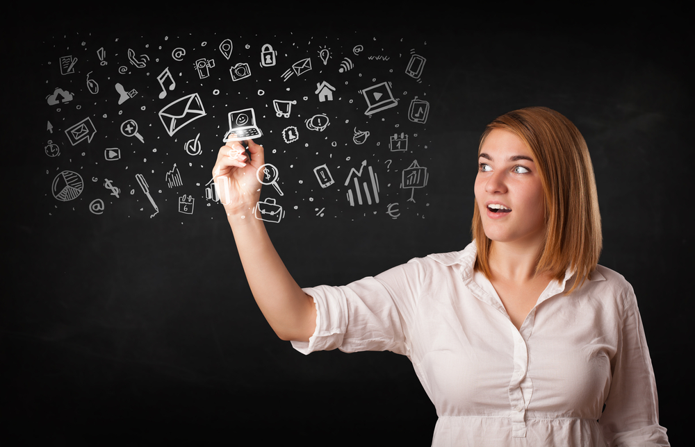 Young woman drawing and sketching icons and symbols on white background