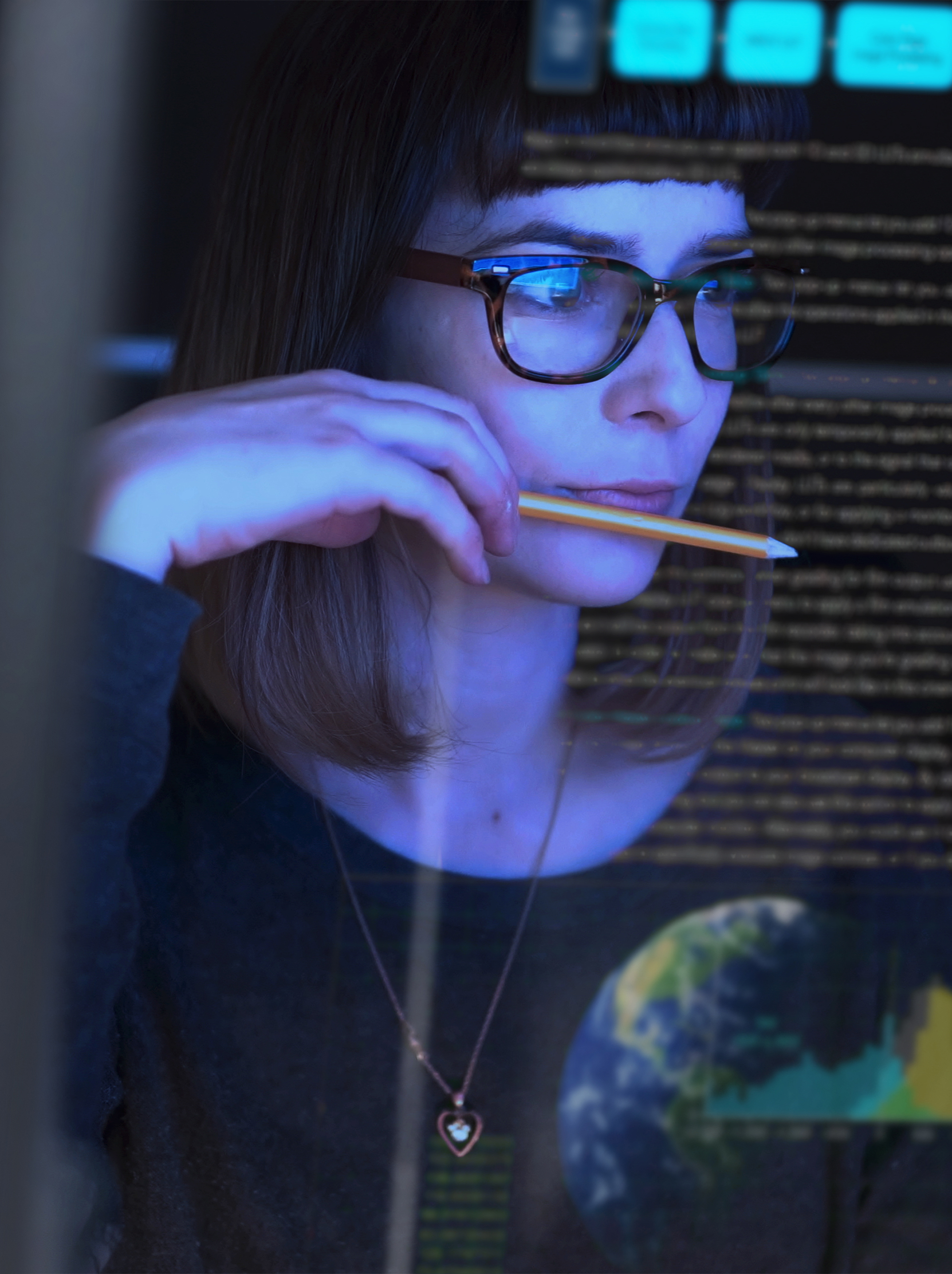 woman studying a see through computer screen 