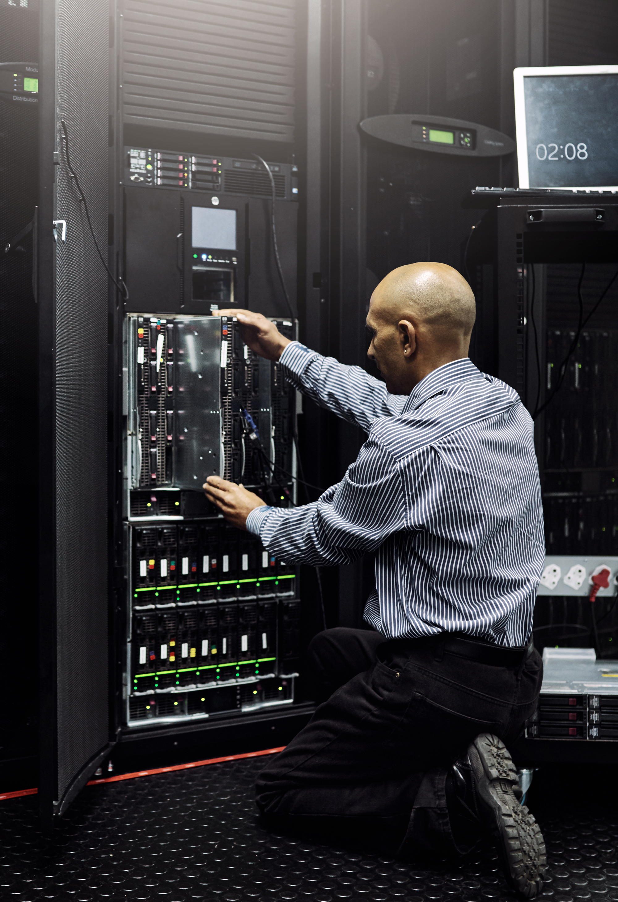 IT technician repairing a computer