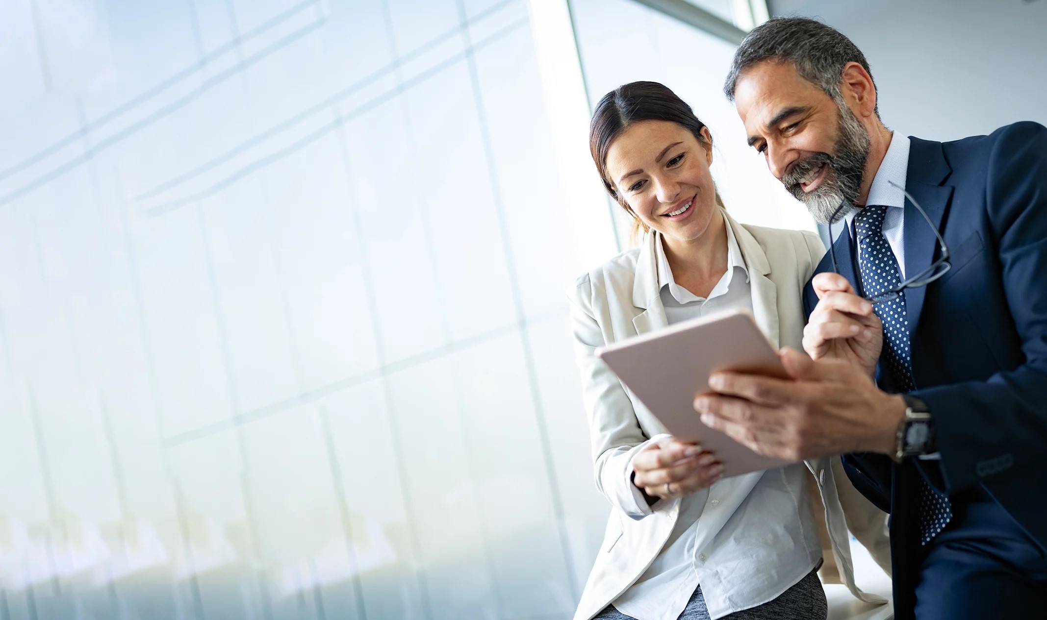 business colleagues in modern office using tablet