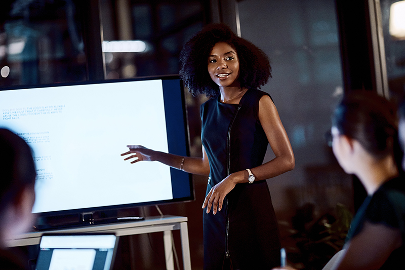  young businesswoman delivering a presentation during a meeting