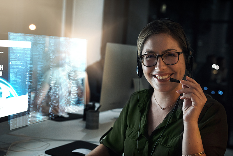 Women wearing a headset in a tech office