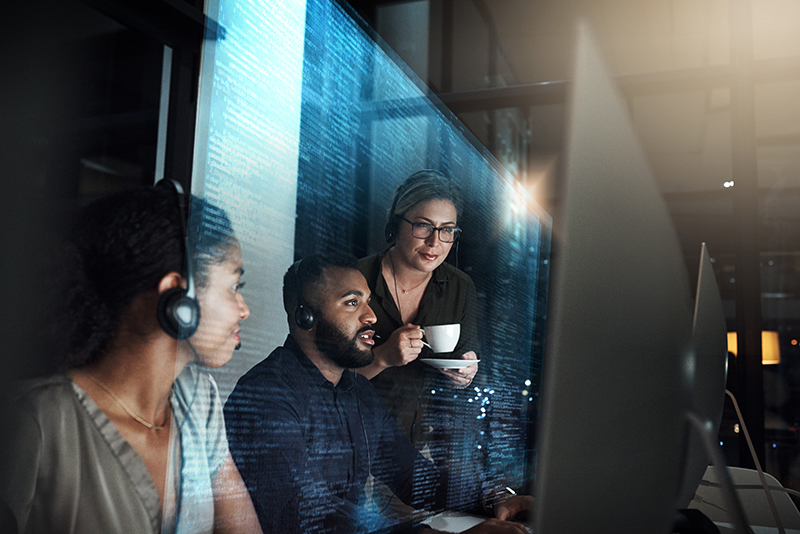 People working in a tech office