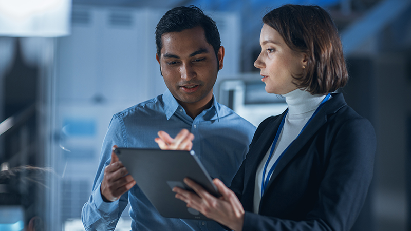 Female Project Manager Talks With Chief Engineer