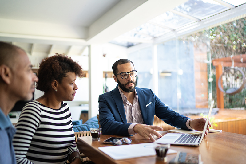 Couple talking to finance advisor 