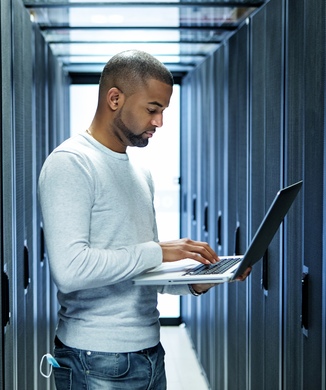 A black male server room technician working