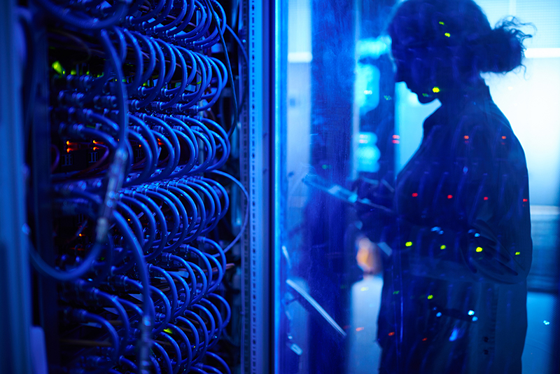 Woman is working in server room