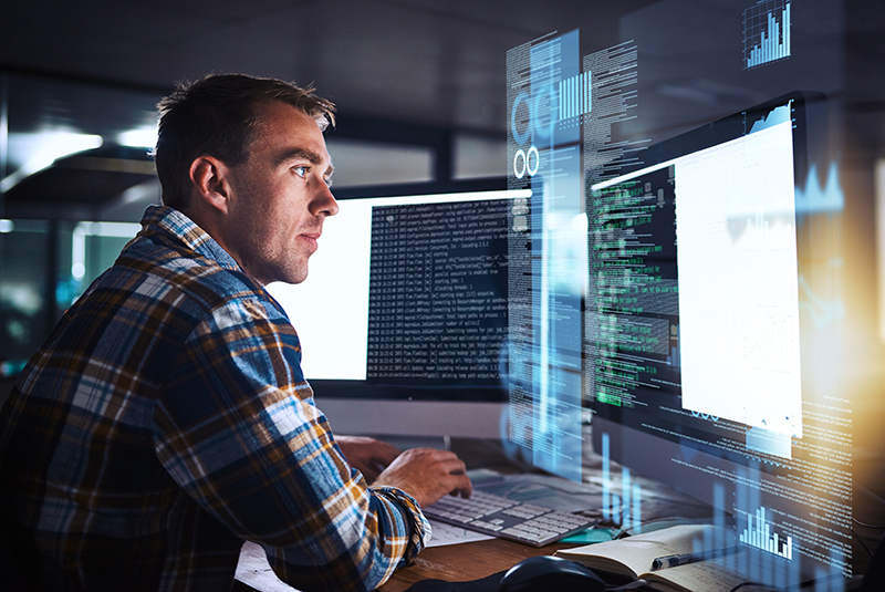 Programmer working on computer code