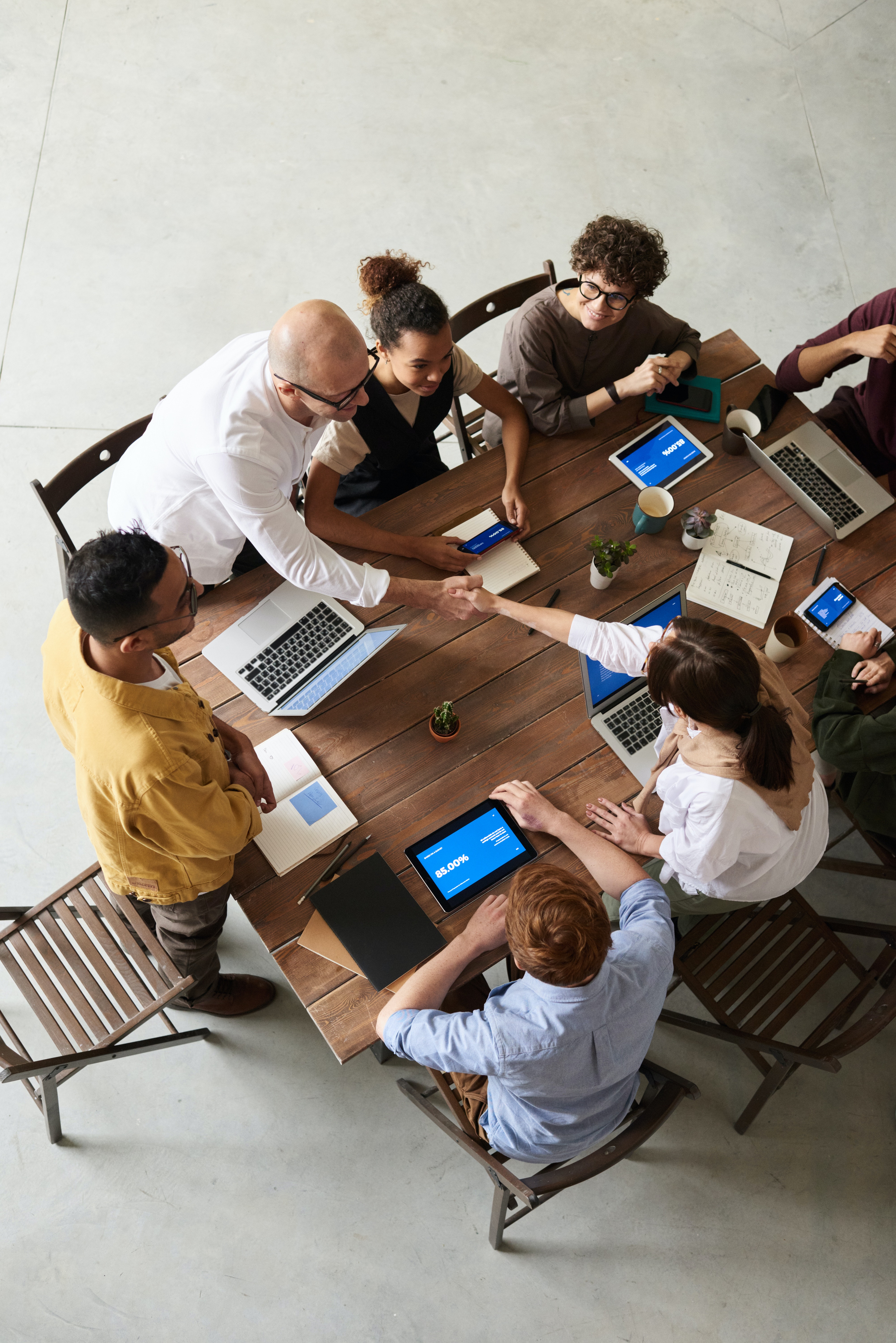 People working on a communal desk
