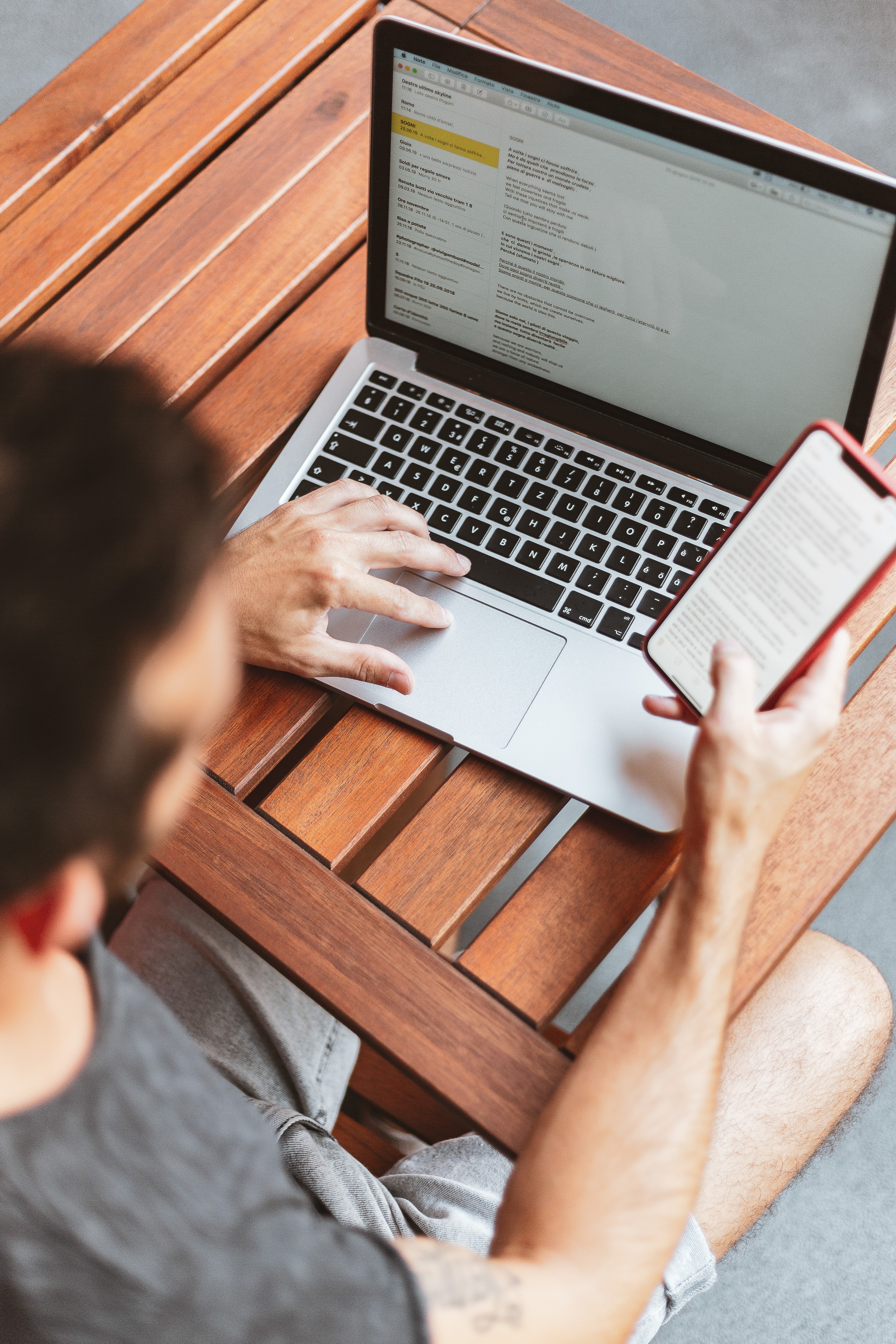 Man working on his phone and laptop